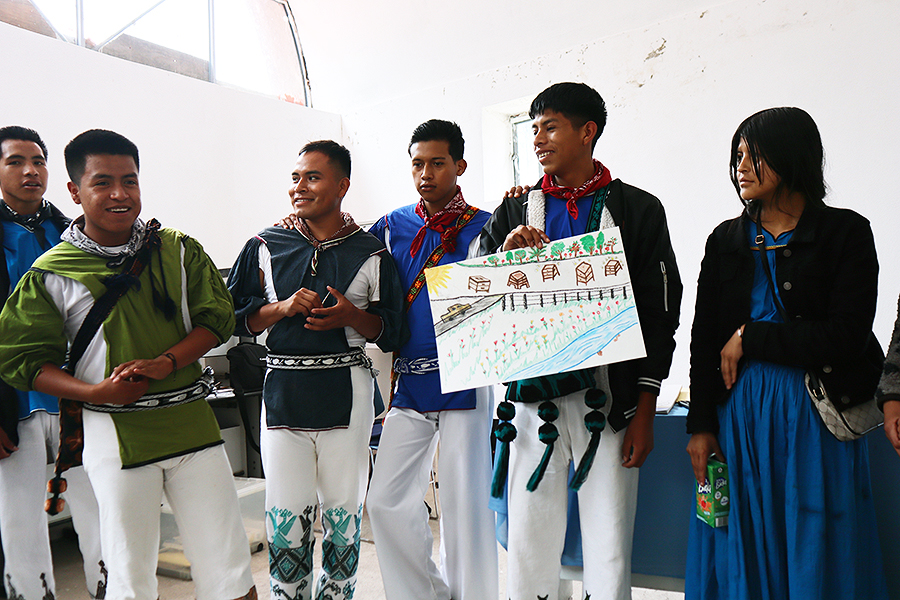 Students presenting their designs for the location of the beehives