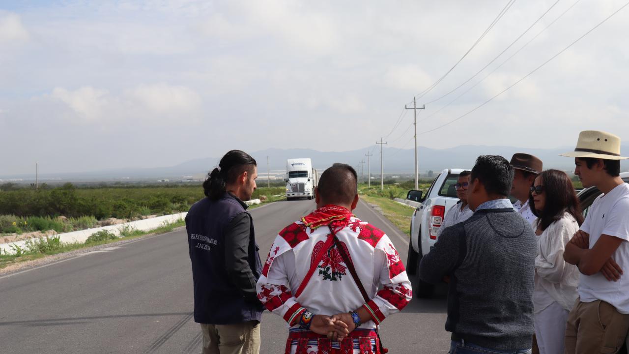Mexican human rights and Wixárika delegates observe the passing of egg cargo from the new industrial plants. Photography by Author, 2022.