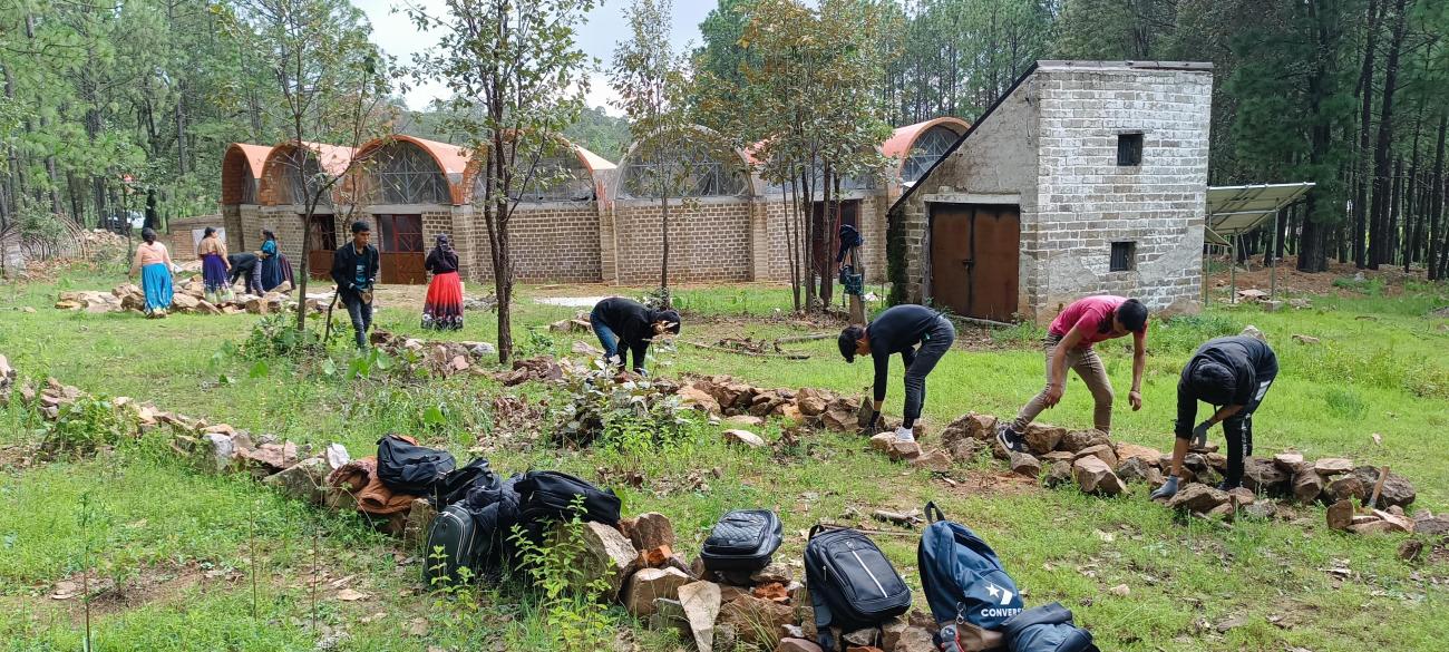 Tamaatsi Páritsika students build a stone wall around their new campus 2024