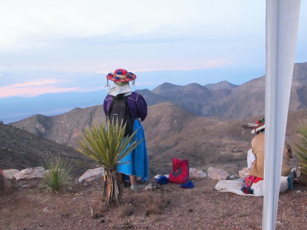 A Wixarika woman overlooks the Sierra de Catorce at dawn. (Tracy L. Barnett)